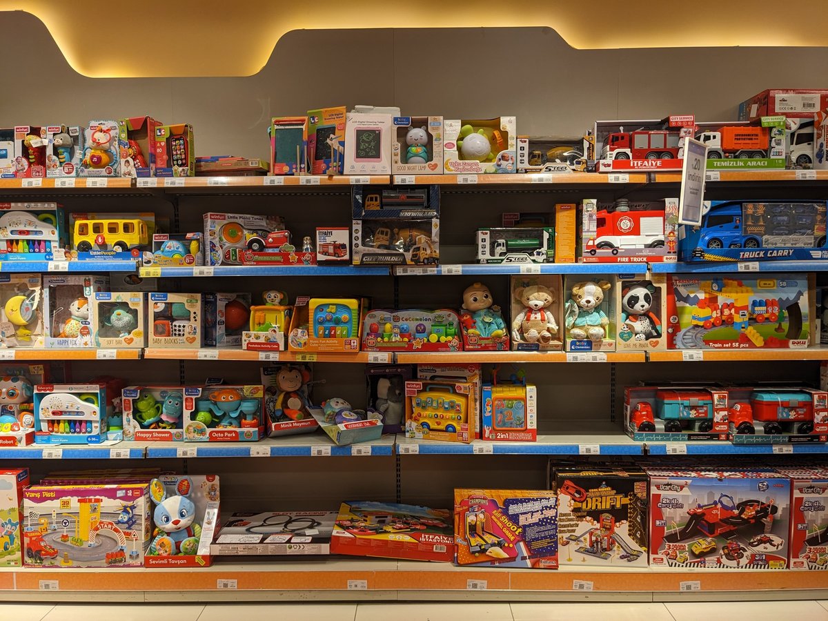 A colourful children's toy rack in a store